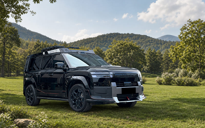 Front and widebody upgrade on a black SUV in an outdoor setting