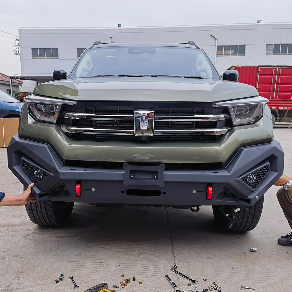 Aftermarket front bumper being checked for vehicle fitment on an SUV