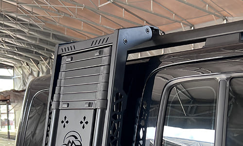 Close view of a side ladder mounted beside an SUV rear door
