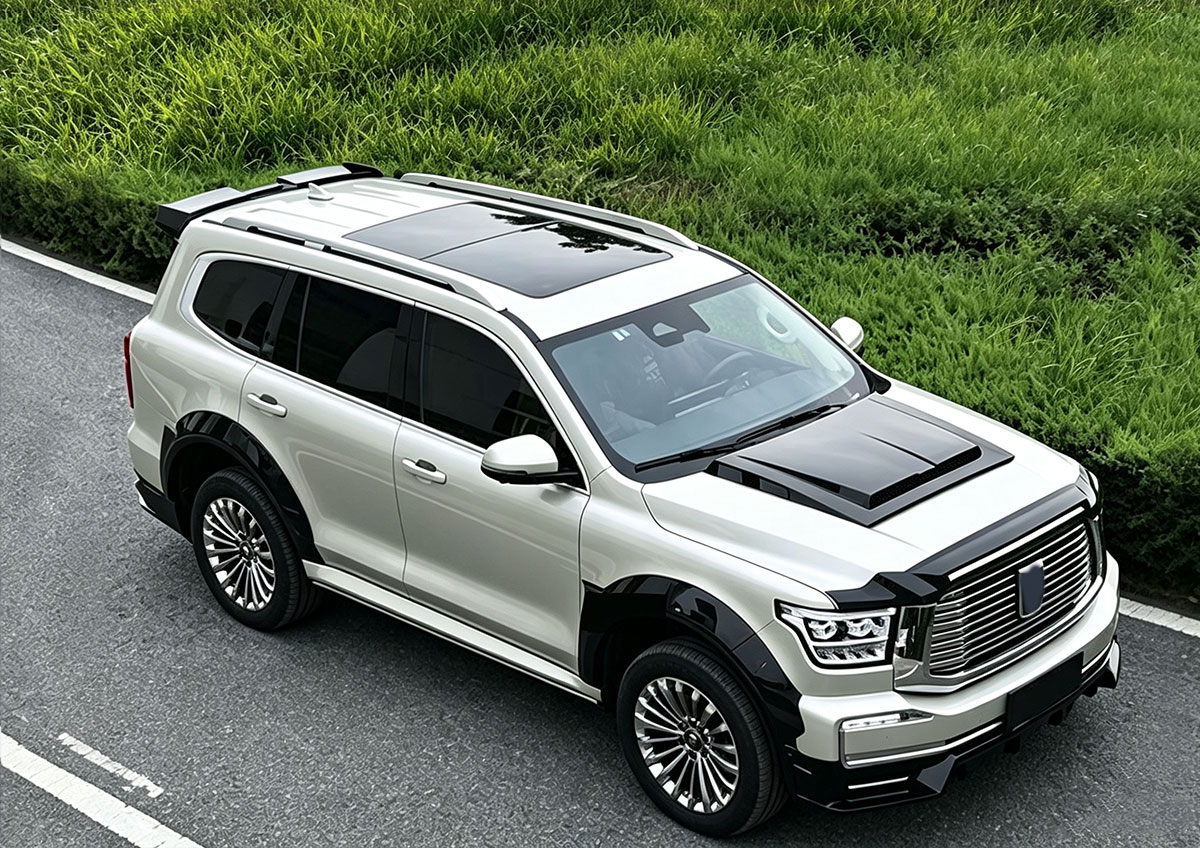White Tank 500 fitted with exterior body kit from an elevated front three-quarter view